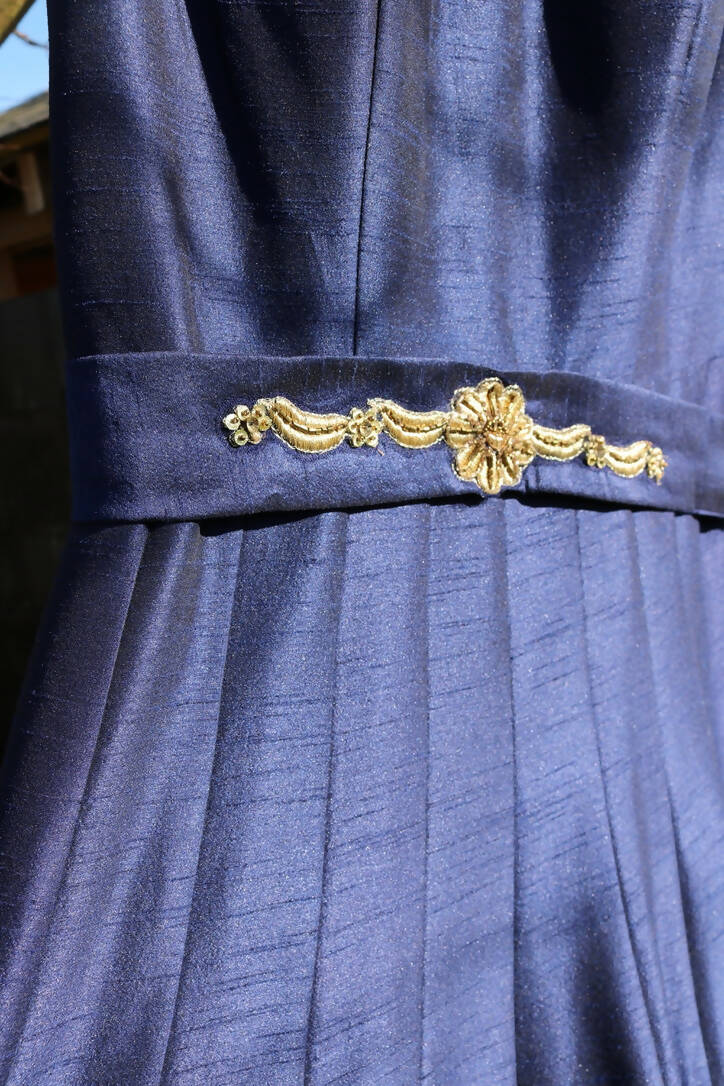 Navy blue dress with gold embellishments